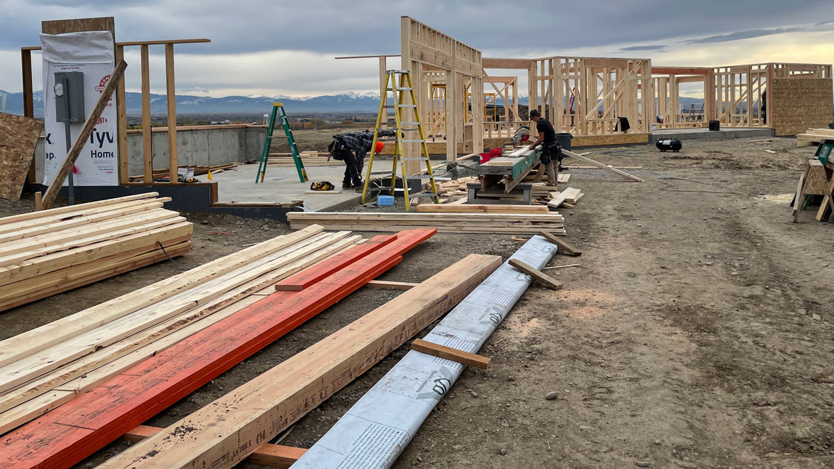 Stacks of lumber and building materials at a construction site