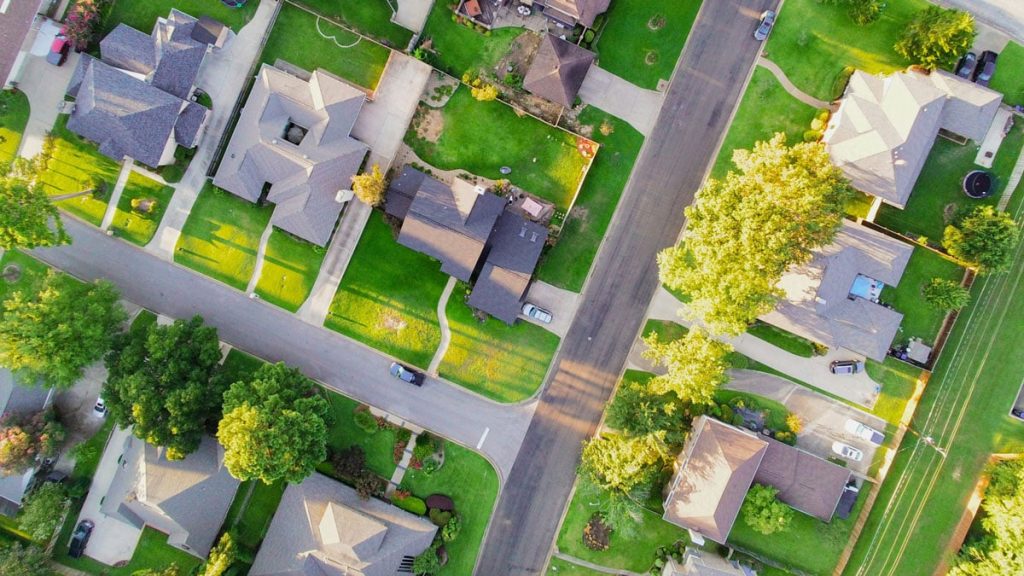 An overhead image of a neighborhood representing location specific cost factors