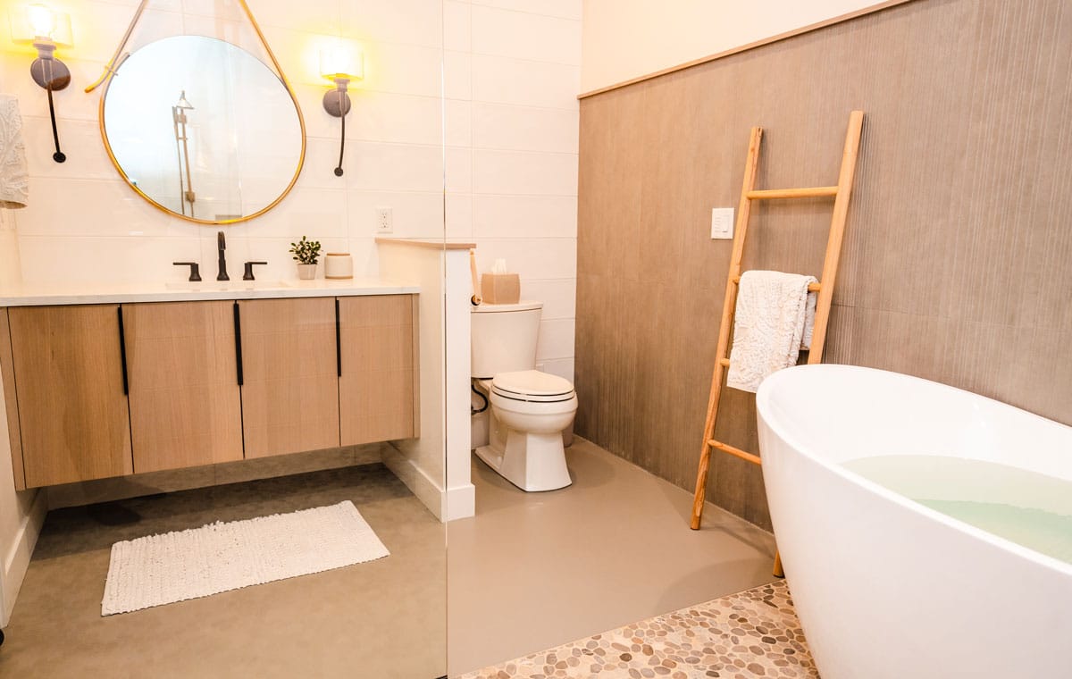 Bathroom interior with high-end cabinetry, tile, and plumbing fixtures